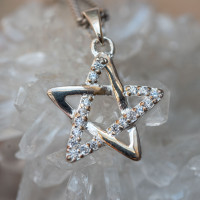 Silver star pendant featuring an intertwined five-point design embellished with small crystals.