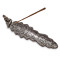 Holder for incense sticks made of white metal with Buddha
