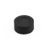 Round black charcoal tablet for burning incense on a white background